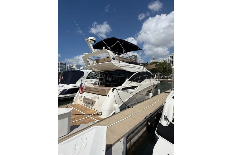 Tea Time III Yacht Photos Pics 2018 Sea Ray Fly 400 yacht docked under a clear blue sky.