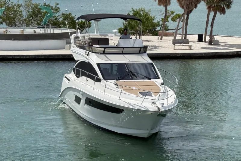 Tea Time III Yacht Photos Pics 2018 Sea Ray Fly 400 yacht cruising in a scenic marina setting.