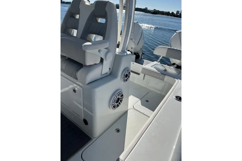  Yacht Photos Pics 2022 Costa Custom Boats 264 interior with seating and speakers on a sunny day.