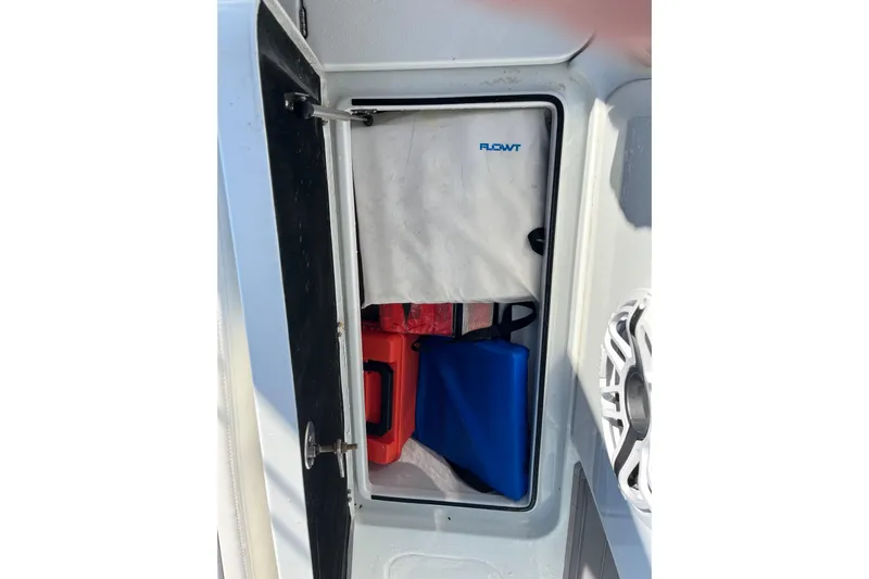  Yacht Photos Pics Storage compartment on a 2022 Costa Custom Boats 264, featuring safety equipment.
