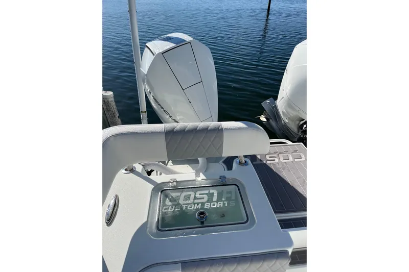  Yacht Photos Pics 2022 Costa Custom Boats 264 with dual engines, docked on calm water.