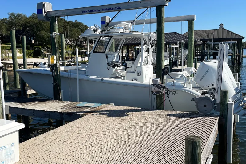 Yacht Photos Pics 2022 Costa Custom Boats 264 docked at a marina with Mercury outboard engine.