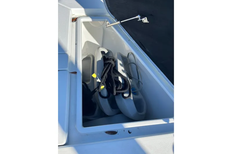  Yacht Photos Pics Storage compartment of 2022 Costa Custom Boats 264 with ropes and fenders.