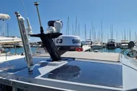 2024 Saxdor 320 GTC yacht docked in a marina, showcasing advanced navigation equipment.