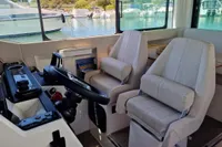 Interior of 2024 Saxdor 320 GTC boat with modern helm and comfortable seating.