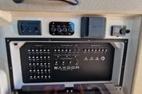 Control panel of 2024 Saxdor 320 GTC yacht with various switches and indicators.