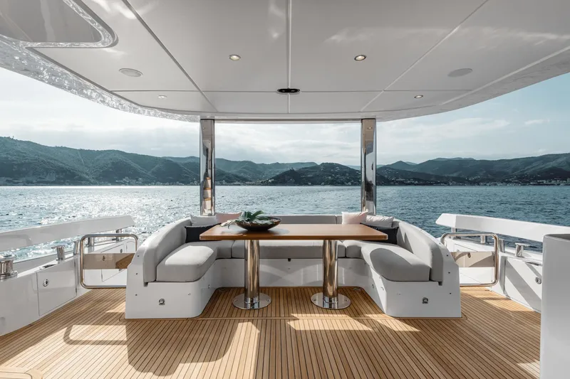  Yacht Photos Pics Luxurious 2025 Azimut 78 Flybridge yacht with elegant outdoor seating and scenic ocean view.
