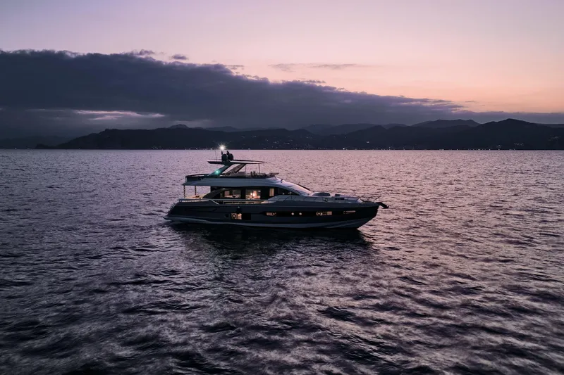  Yacht Photos Pics 2025 Azimut 78 Flybridge yacht at sunset on calm waters.