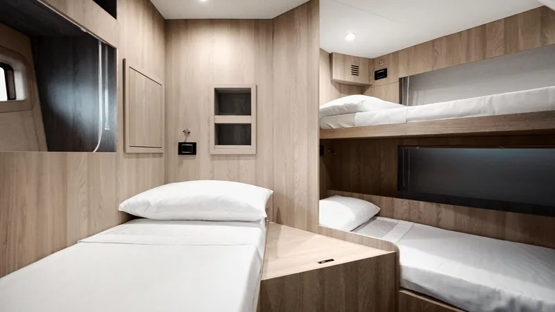  Yacht Photos Pics Luxurious cabin interior of 2025 Azimut 78 Flybridge yacht with modern wood finish.