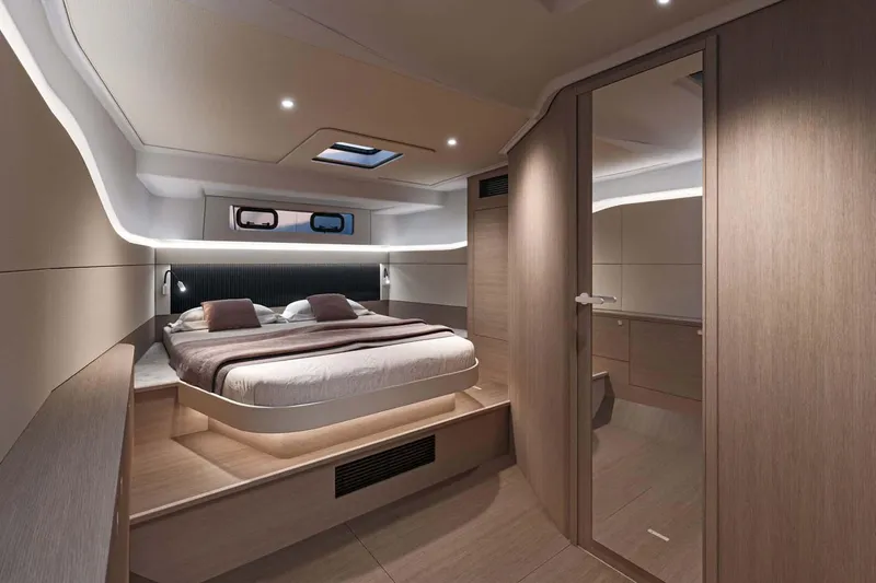  Yacht Photos Pics Manufacturer Provided Image: Luxurious cabin interior of 2025 Beneteau Gran Turismo 40 yacht, featuring modern design and cozy bedding.