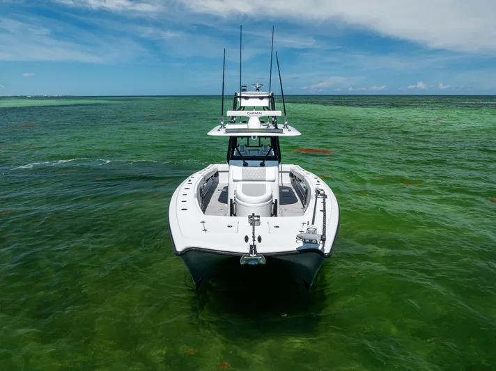  Yacht Photos Pics 2025 Freeman 34 VH boat on clear green water under blue sky.
