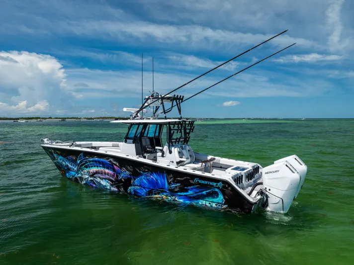  Yacht Photos Pics 2025 Freeman 34 VH boat with vibrant marine graphics on open water.