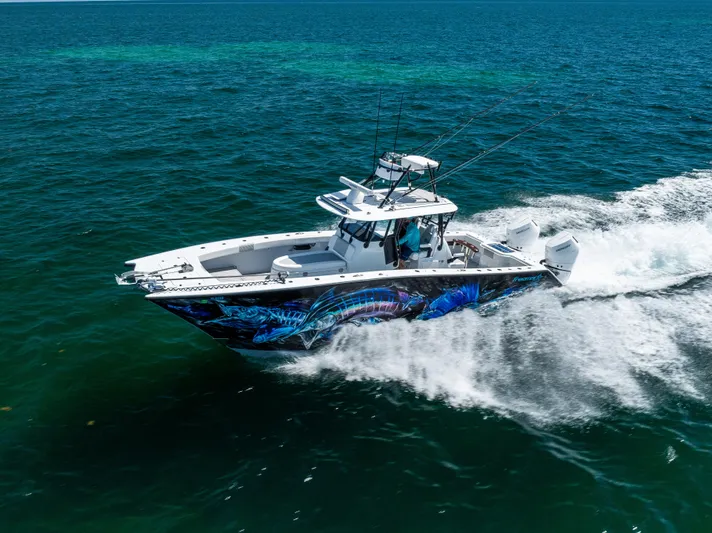  Yacht Photos Pics Freeman 34 VH 2025 boat cruising on open ocean with vibrant hull design.