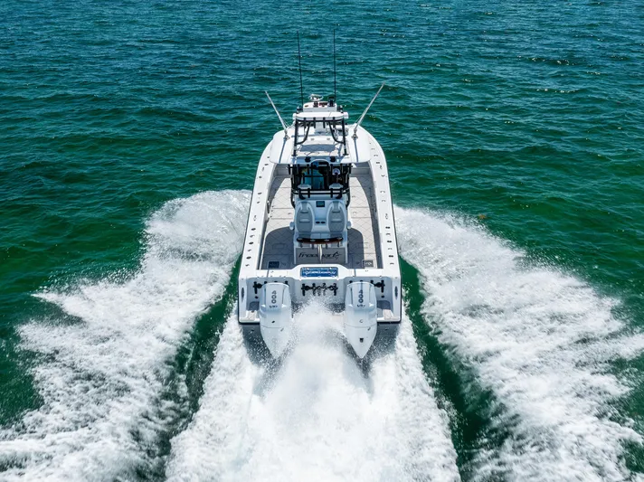  Yacht Photos Pics Freeman 34 VH 2025 boat cruising on open water, rear view.