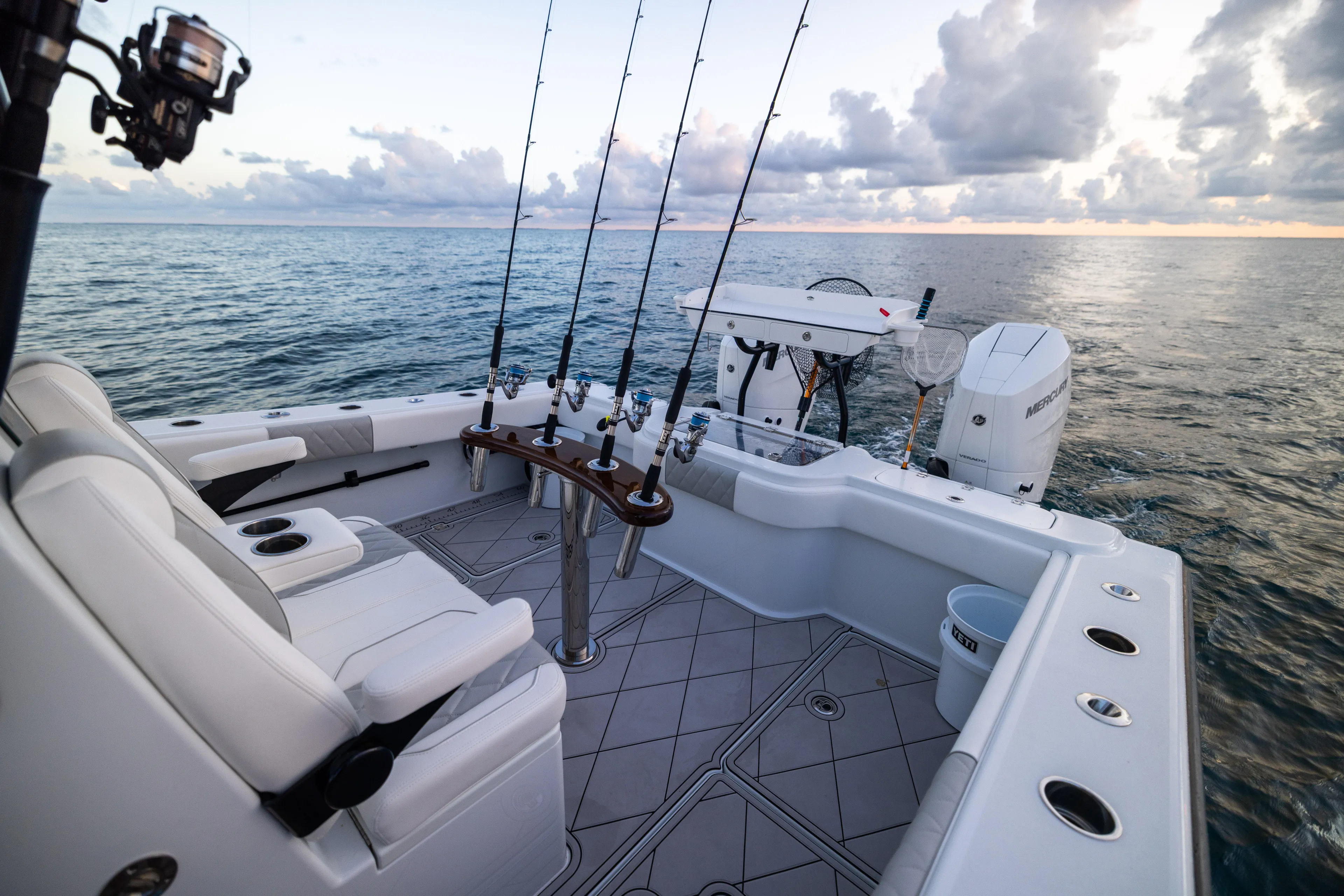  Yacht Photos Pics 2025 Freeman 34 VH fishing boat with rods, ocean view, and sunset sky.