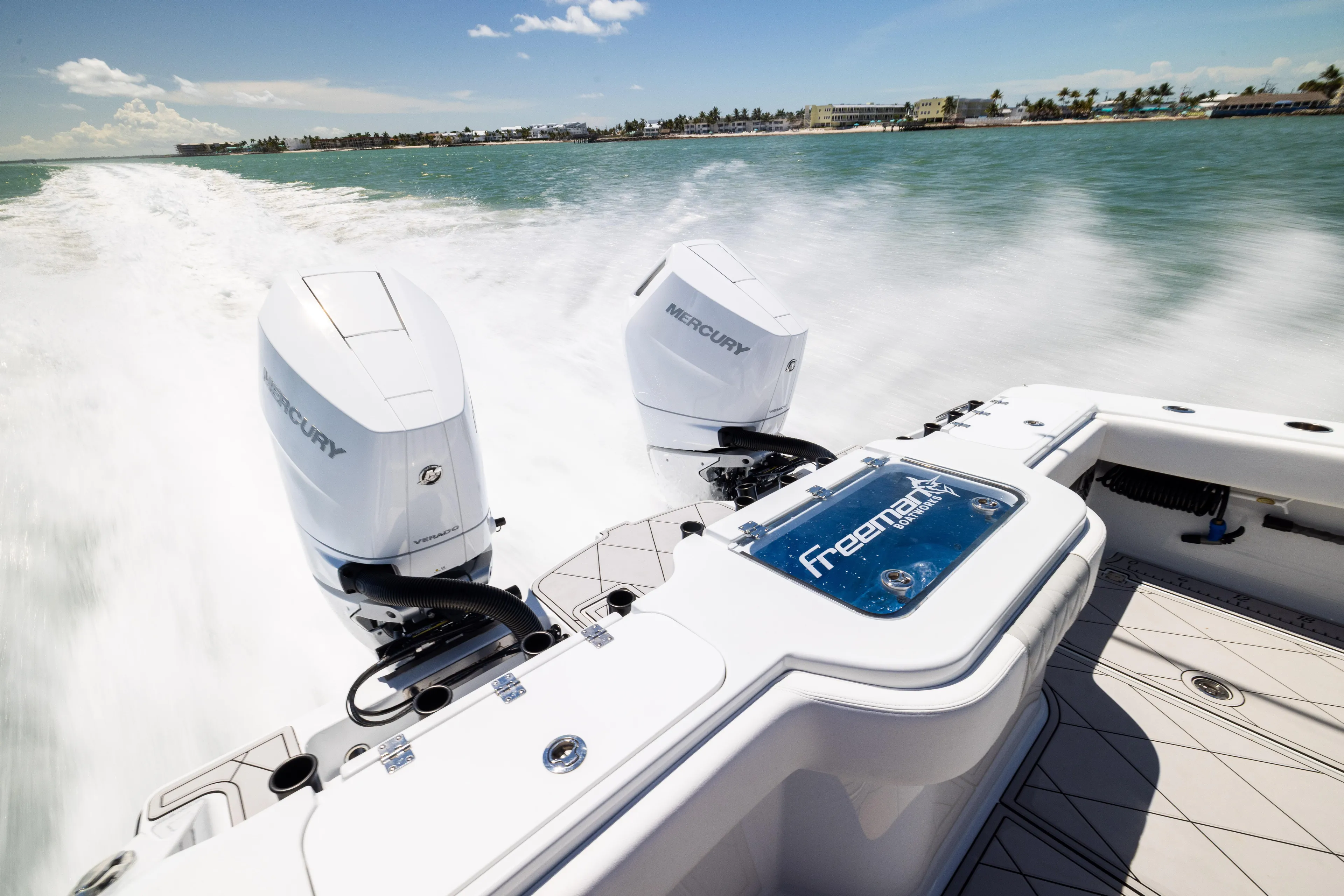  Yacht Photos Pics 2025 Freeman 34 VH boat with dual Mercury engines speeding on water.