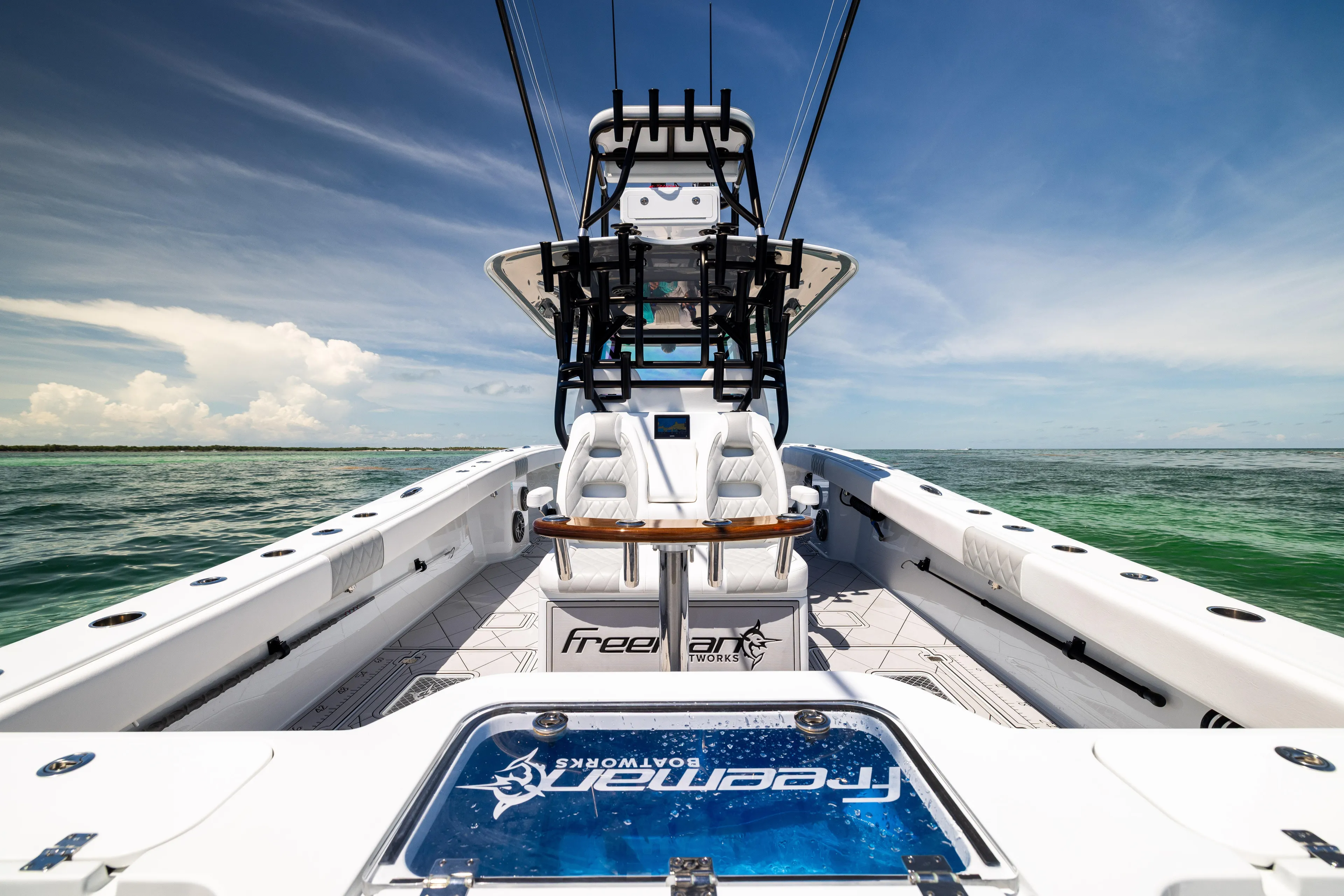  Yacht Photos Pics Freeman 34 VH 2025 boat on open water, showcasing sleek design and spacious deck.