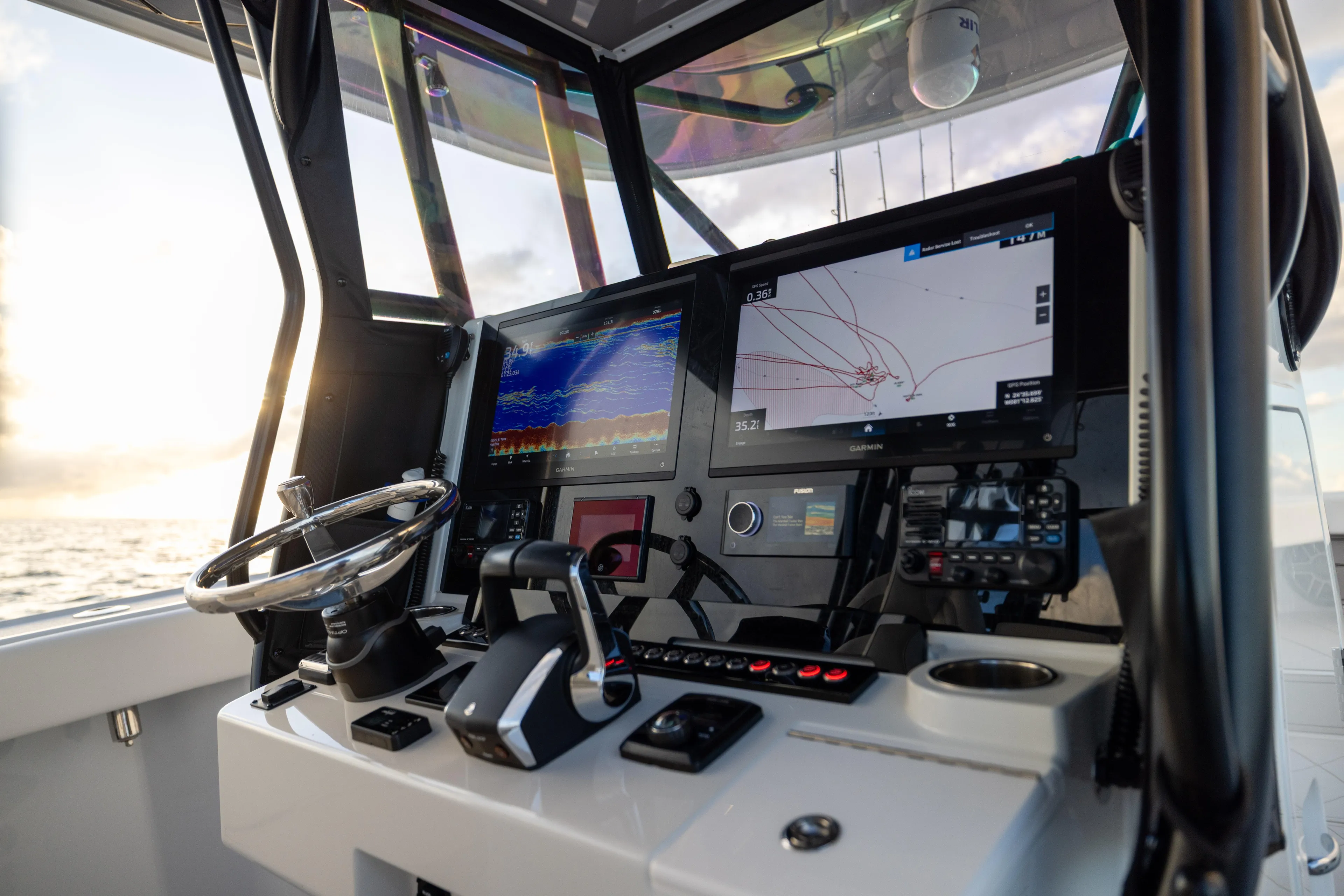  Yacht Photos Pics Freeman 34 VH 2025 boat cockpit with advanced navigation displays and controls at sea.