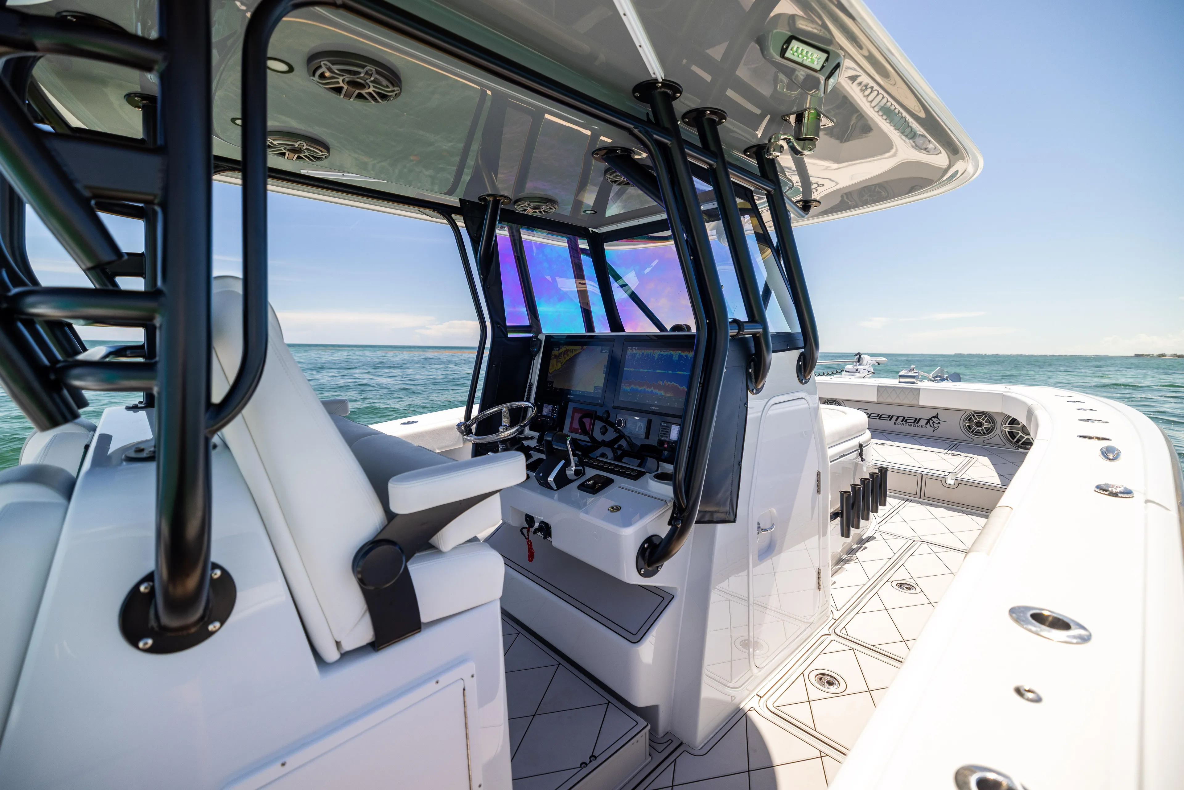  Yacht Photos Pics 2025 Freeman 34 VH boat interior with advanced navigation system on open water.