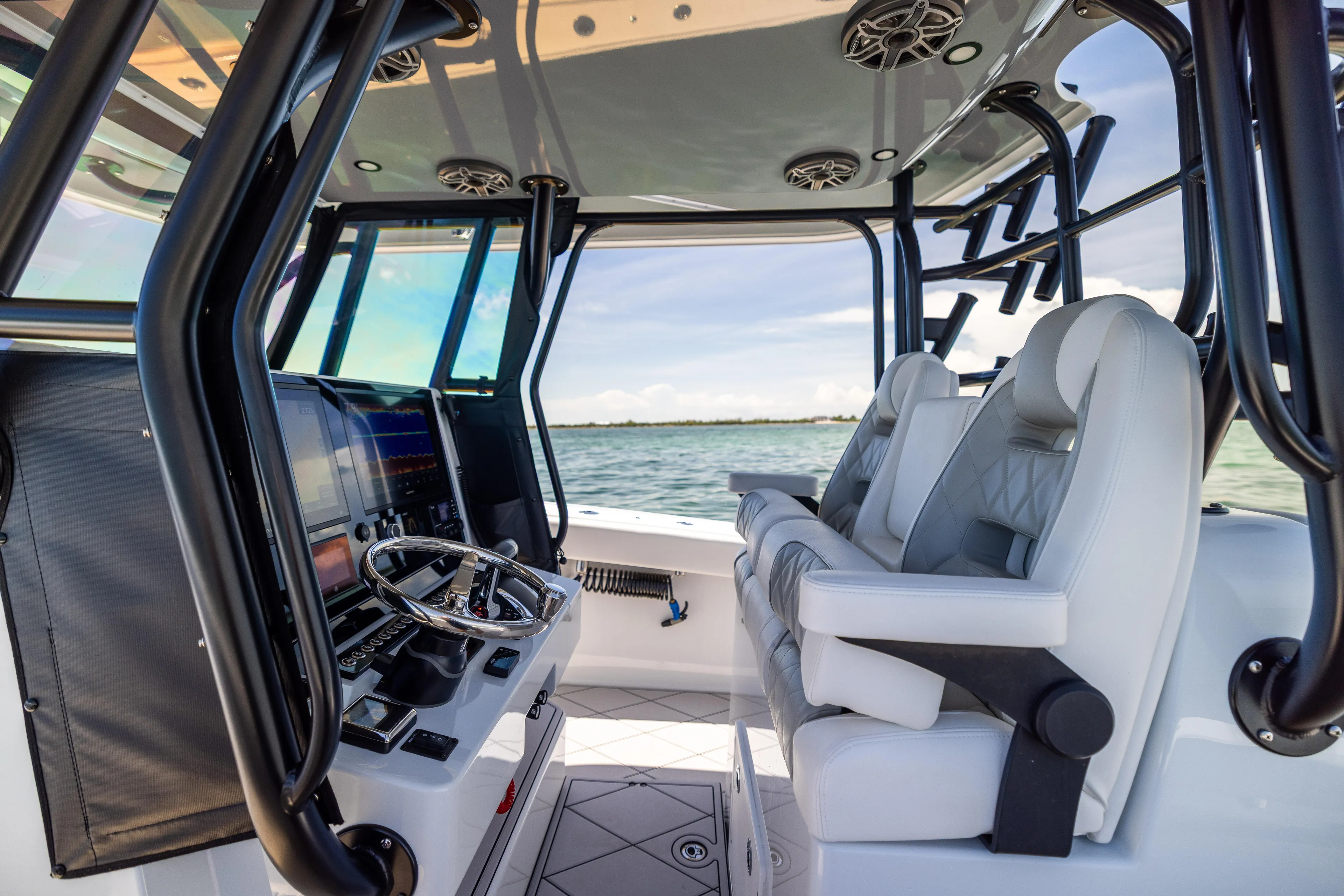  Yacht Photos Pics Interior of 2025 Freeman 34 VH boat with modern helm and luxurious seating.