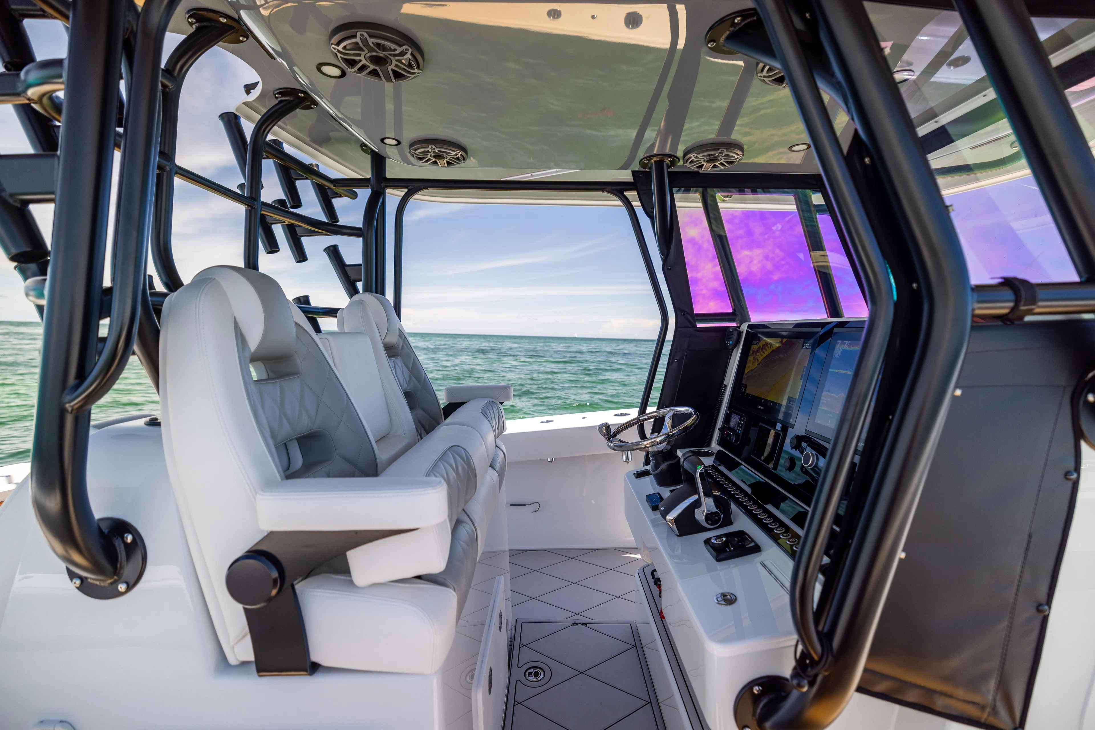  Yacht Photos Pics Interior of 2025 Freeman 34 VH boat with modern helm and seating, overlooking the ocean.