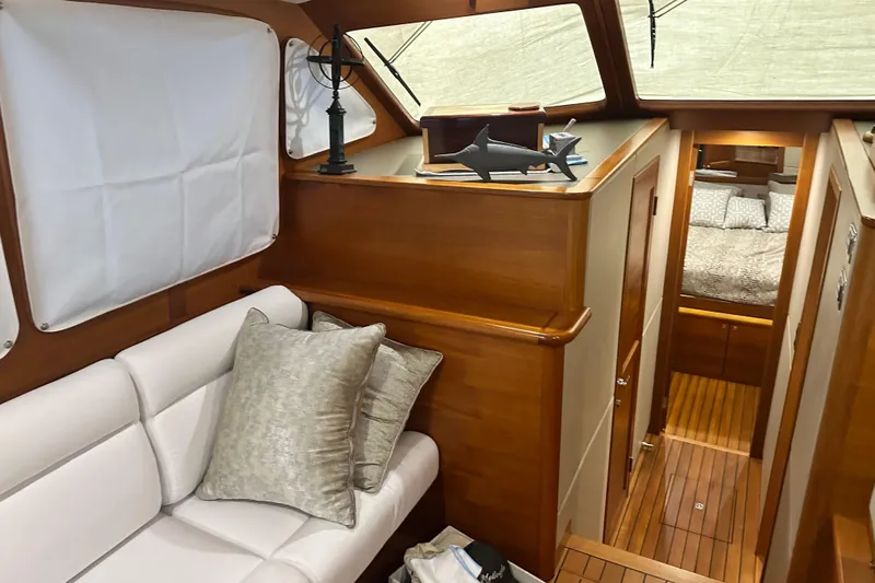 “no Name” Yacht Photos Pics Luxurious interior of 2017 Palm Beach PB42 yacht with elegant wood finish and cozy seating.