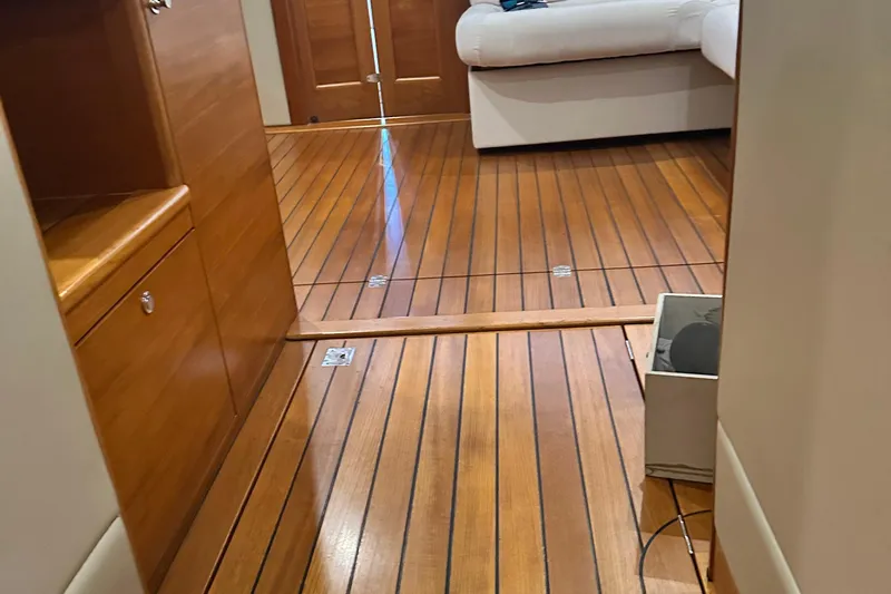 “no Name” Yacht Photos Pics Interior of 2017 Palm Beach PB42 yacht with wooden flooring and white seating.