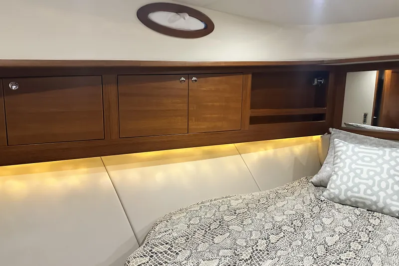 “no Name” Yacht Photos Pics Luxurious 2017 Palm Beach PB42 yacht interior with elegant wood cabinetry and cozy bedding.