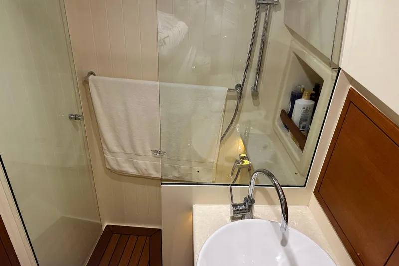 “no Name” Yacht Photos Pics Luxurious bathroom in 2017 Palm Beach PB42 yacht with modern fixtures and elegant design.