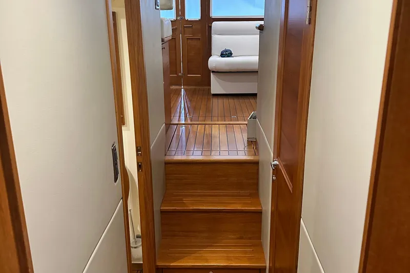 “no Name” Yacht Photos Pics Interior of 2017 Palm Beach PB42 yacht with wooden flooring and seating area.
