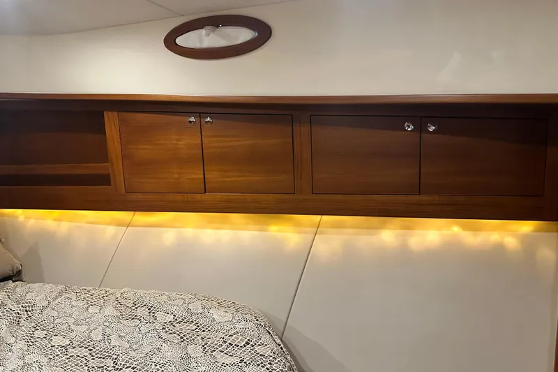 “no Name” Yacht Photos Pics Luxurious 2017 Palm Beach PB42 yacht interior with wooden cabinets and ambient lighting.