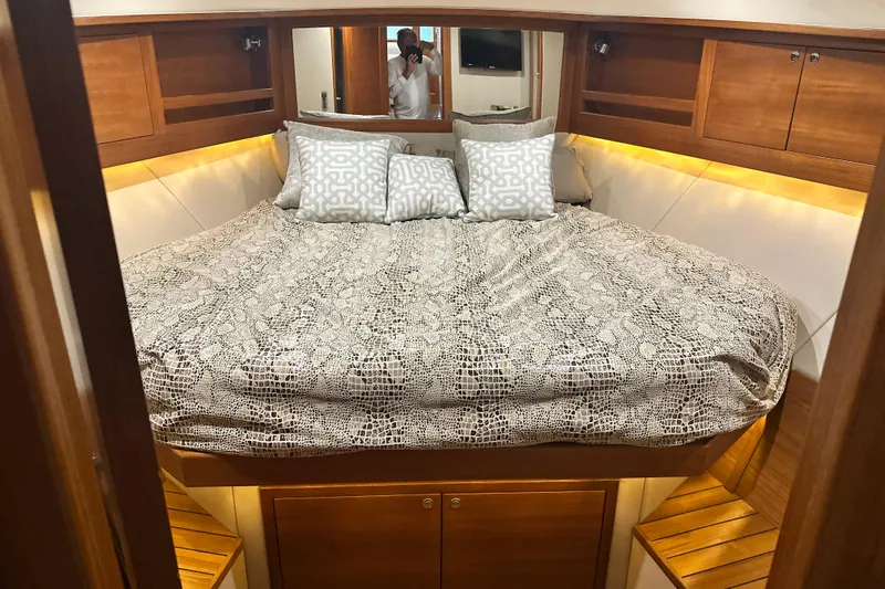 “no Name” Yacht Photos Pics Luxurious cabin interior of 2017 Palm Beach PB42 yacht with cozy bedding and wooden accents.