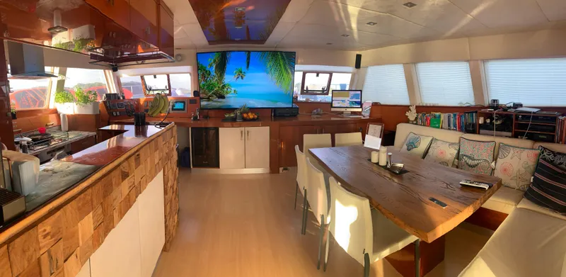 Talon Yacht Photos Pics Luxurious interior of 2011 Sunreef 62 yacht with modern kitchen and dining area.