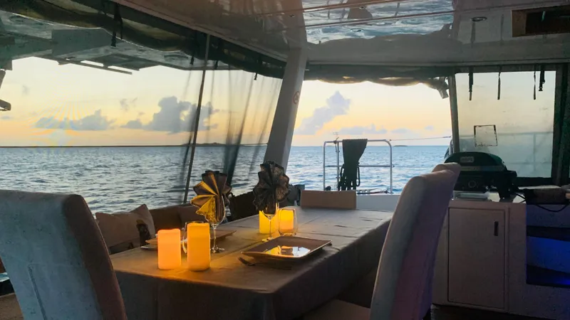 Talon Yacht Photos Pics Luxurious Sunreef 62 yacht interior with elegant dining setup at sunset, 2011 model.