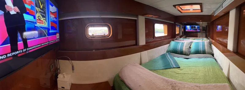 Talon Yacht Photos Pics Luxurious cabin interior of 2011 Sunreef 62 yacht with TV and cozy bedding.