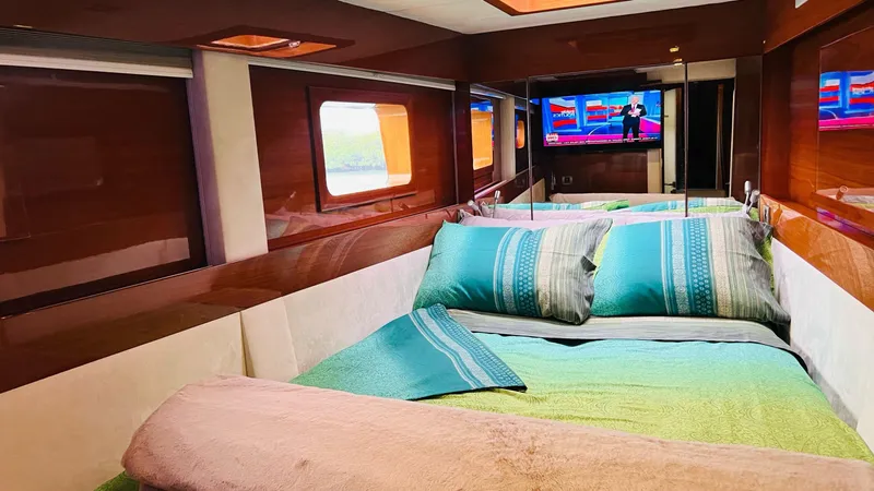 Talon Yacht Photos Pics Luxurious cabin interior of 2011 Sunreef 62 yacht with cozy bedding and TV.