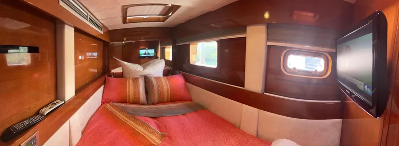 Talon Yacht Photos Pics Luxurious cabin interior of 2011 Sunreef 62 yacht with elegant wood finish and cozy bedding.