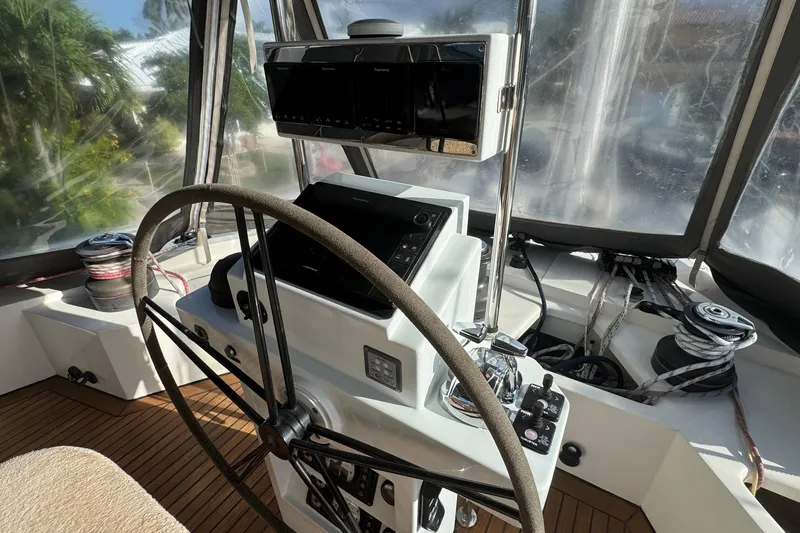 Talon Yacht Photos Pics Helm of 2011 Sunreef 62 yacht with navigation equipment and steering wheel.