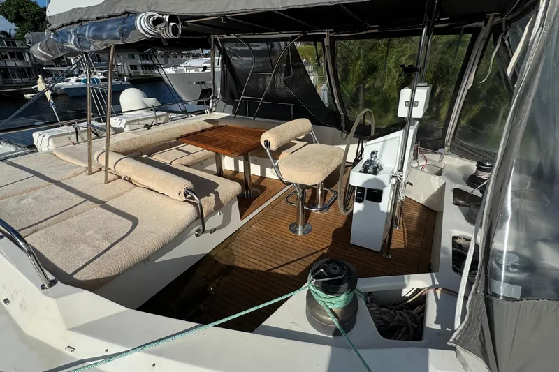 Talon Yacht Photos Pics Luxurious 2011 Sunreef 62 yacht cockpit with seating, table, and helm station.