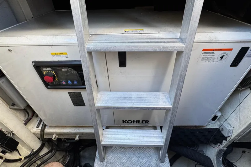 Talon Yacht Photos Pics Engine room of 2011 Sunreef 62 yacht with Kohler generator and ladder.