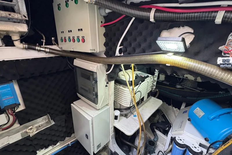 Talon Yacht Photos Pics Engine room of a 2011 Sunreef 62 yacht with control panels and equipment.