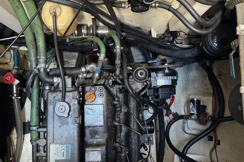 Talon Yacht Photos Pics Engine room of a 2011 Sunreef 62 yacht, showcasing complex machinery and hoses.