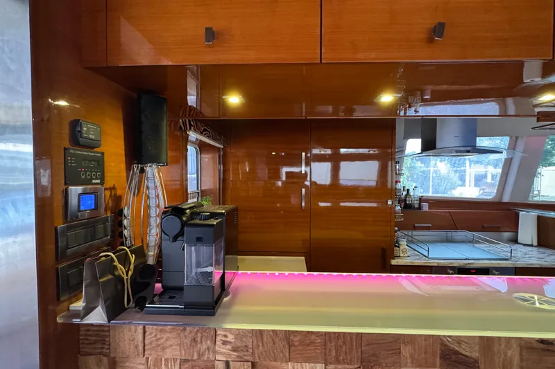 Talon Yacht Photos Pics Luxurious Sunreef 62 yacht kitchen interior with modern appliances and sleek wooden cabinetry, 2011 model.