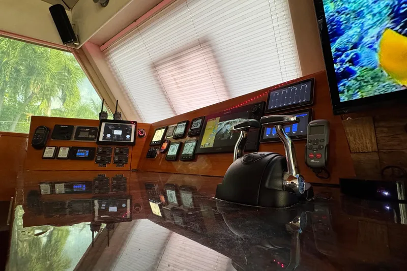 Talon Yacht Photos Pics Control panel of a 2011 Sunreef 62 yacht with navigation instruments and screens.