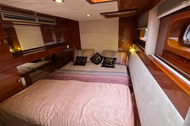 Talon Yacht Photos Pics Luxurious bedroom interior of 2011 Sunreef 62 yacht with elegant wood finishes.