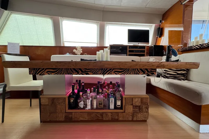 Talon Yacht Photos Pics Luxurious Sunreef 62 yacht interior with stylish bar and zebra-patterned decor, 2011 model.