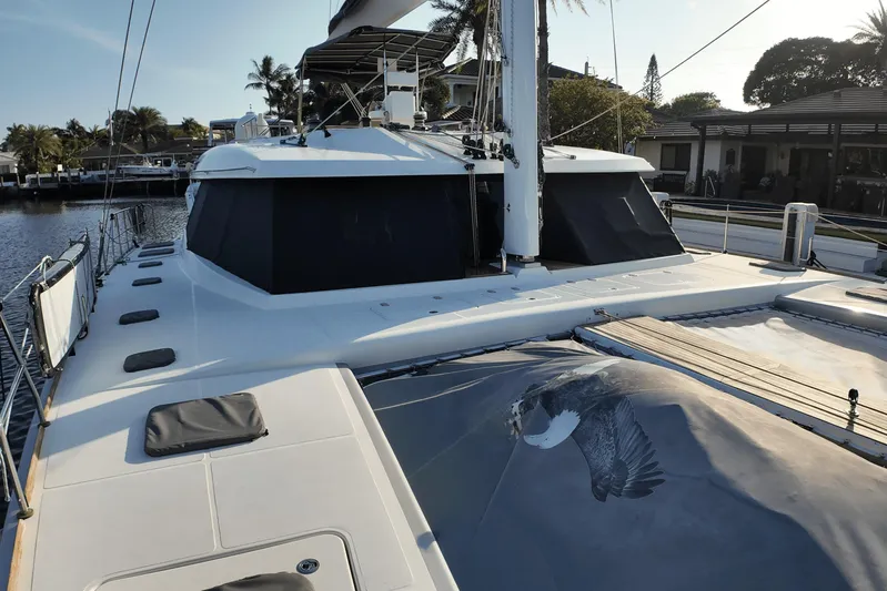 Talon Yacht Photos Pics 2011 Sunreef 62 yacht docked, featuring spacious deck and sleek design.