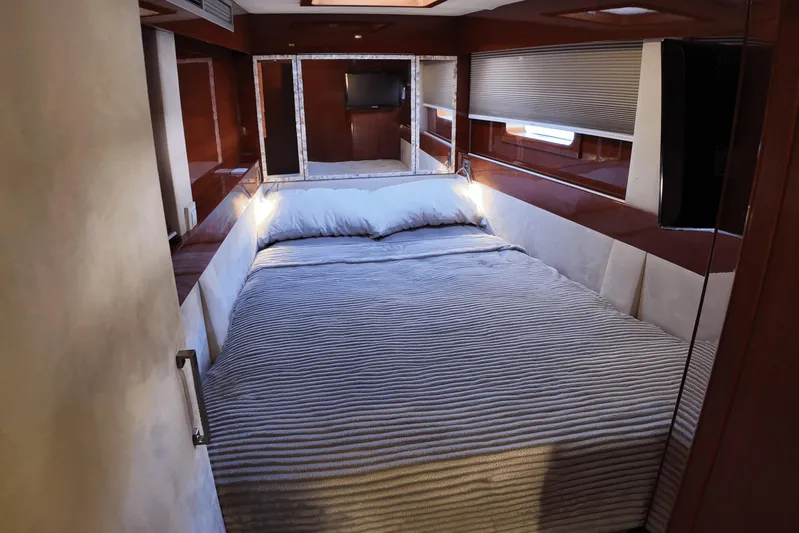 Talon Yacht Photos Pics Luxurious bedroom interior of 2011 Sunreef 62 yacht with cozy bedding and modern design.