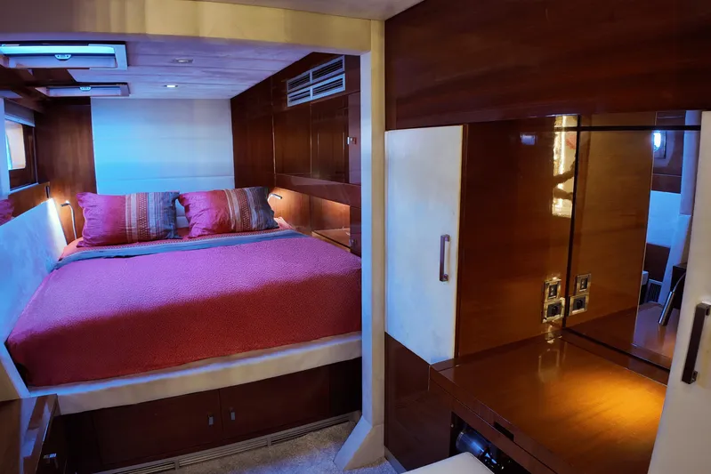 Talon Yacht Photos Pics Luxurious cabin interior of 2011 Sunreef 62 yacht with cozy bed and wooden furnishings.