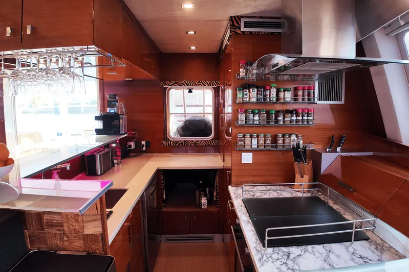 Talon Yacht Photos Pics Luxurious Sunreef 62 yacht kitchen with modern amenities and spice rack, 2011 model.